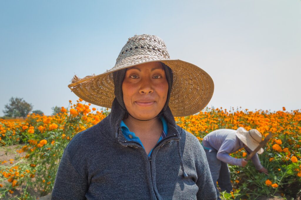 Woman standing in a field of flowers