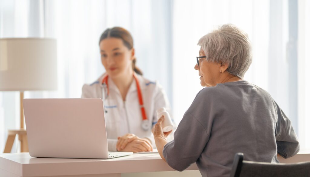 A female patient discussing clinical trial options with a doctor