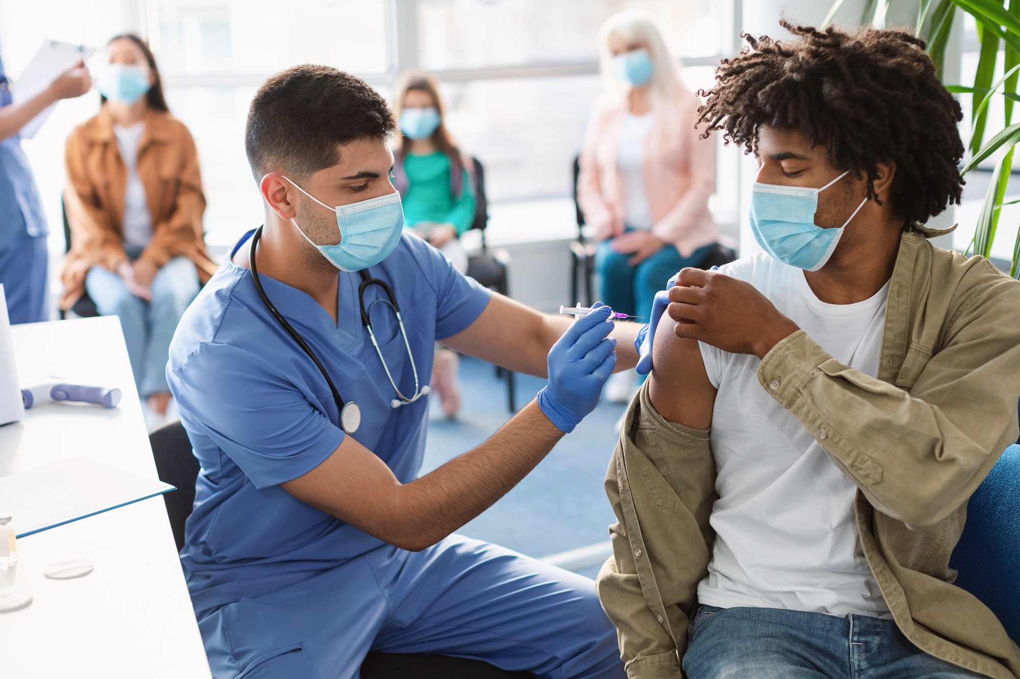 Doctor administering a COVID-19 vaccine