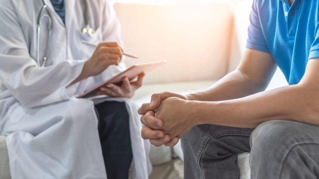 Doctor and patient sitting together at site