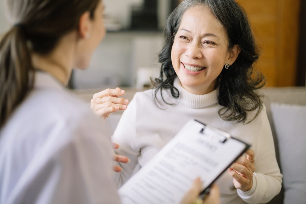 Female patient speaking to doctor about signing up for a clinical trial